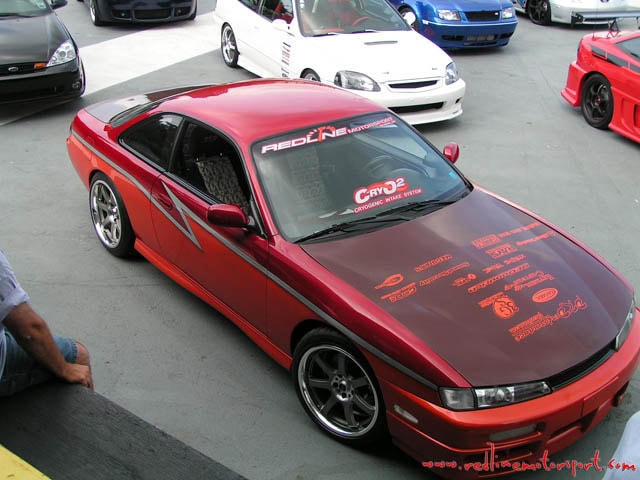 Car show lineup featuring PKPerformance vehicle graphics